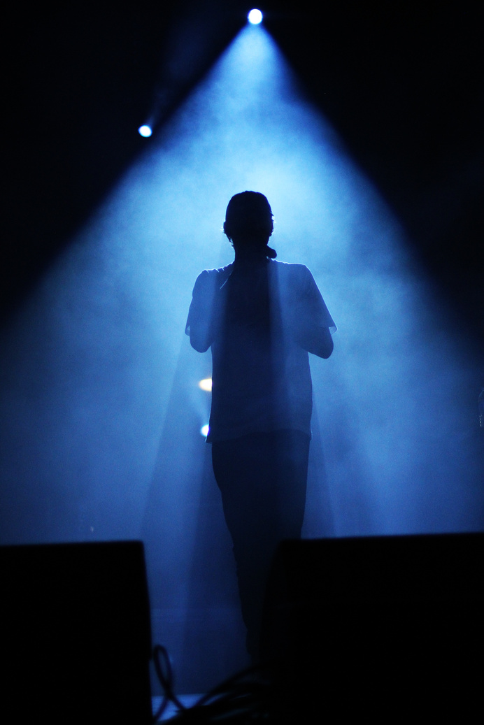 Silhouette of Man Standing on Stage